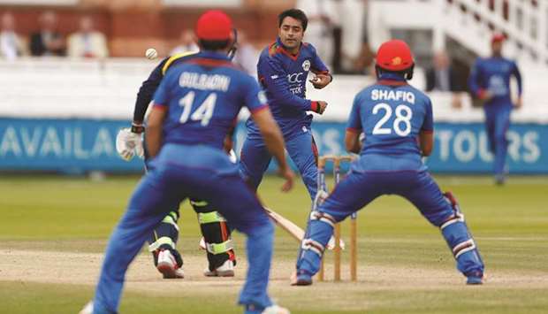 File photo shows Afghanistanu2019s Rashid Khan attempting to run out MCCu2019s Shivnarine Chanderpaul. Khan is expected to be one of Afghanistanu2019s key players during the World Cup.