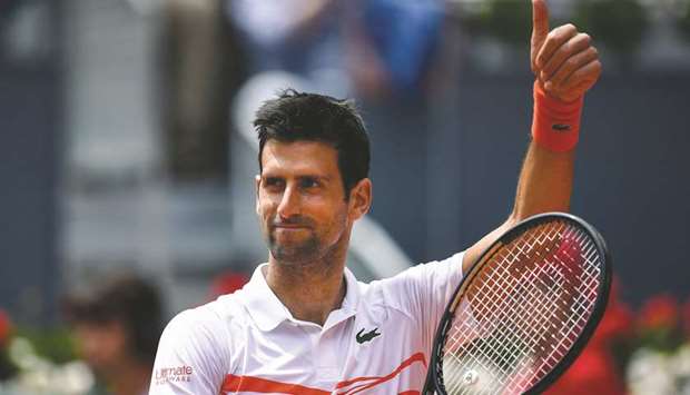 Serbiau2019s Novak Djokovic celebrates after winning his Madrid Open match against USu2019 Taylor Fritz at the Caja Magica in Madrid yesterday. (AFP)