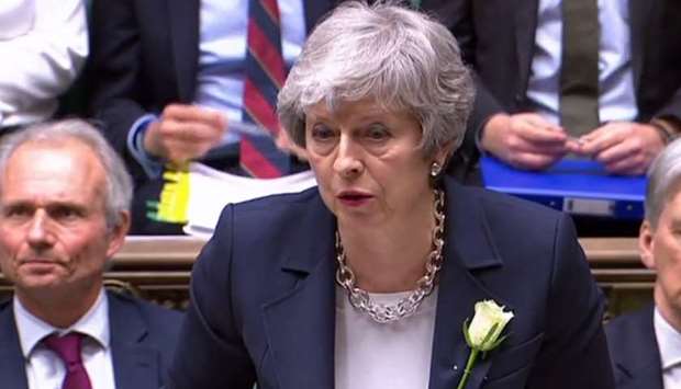 A video grab from footage broadcast by the UK Parliament's Parliamentary Recording Unit (PRU) shows Britain's Prime Minister Theresa May speaking during the weekly Prime Minister's Questions (PMQs) session in the House of Commons. AFP/PRU