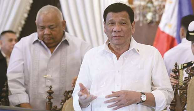 President Rodrigo Duterte talks to members of the cabinet prior to the start of the 37th Cabinet meeting at the Malacanang Palace.