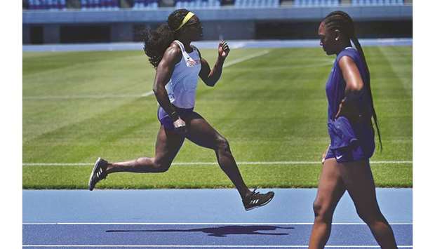 British athletes Anyika Onuora (left) and Perri Shakes-Drayton train with the new mixed 400m relay team at the Todoroki Stadium in Kawasaki yesterday. (AFP)