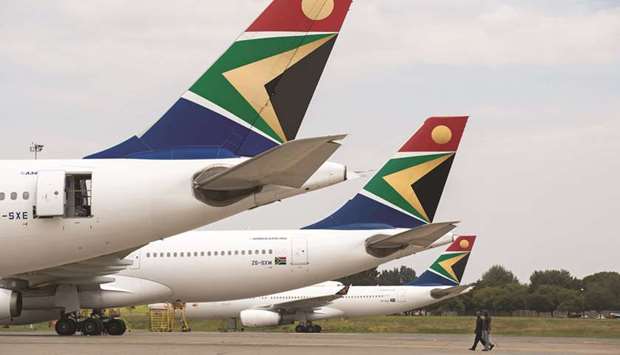 The logo of South African Airways is seen on the tailfins of aircraft parked at O.R. Tambo International airport in Johannesburg (file). By 2035, Africa is estimated to see an extra 192mn passengers a year to make up a total market of 303mn passengers, travelling to and from African destinations.
