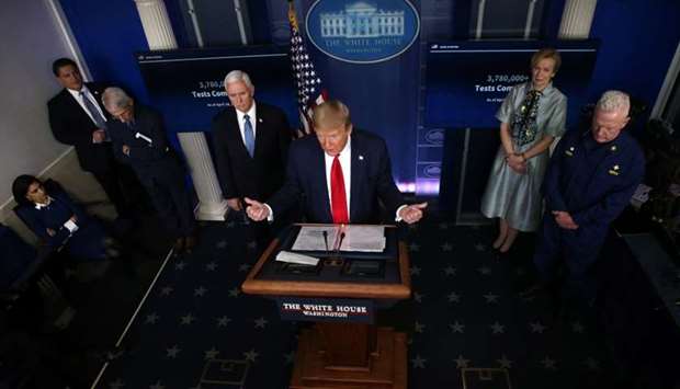 US President Donald Trump answers questions at the daily coronavirus disease task force briefing flanked by Dr. Anthony Fauci, Vice President Mike Pence, Dr. Deborah Birx and Admiral Brett Giroir at the White House in Washington, US