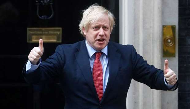 Britain's Prime Minister Boris Johnson reacts outside 10 Downing Street during the Clap for our Carers campaign in support of the NHS, following the outbreak of the coronavirus disease, London, Britain on May 7