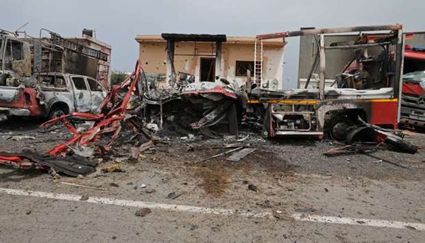 Damaged vehicles are seen at Tripoli's Mitiga airport after it was hit by shelling in Tripoli