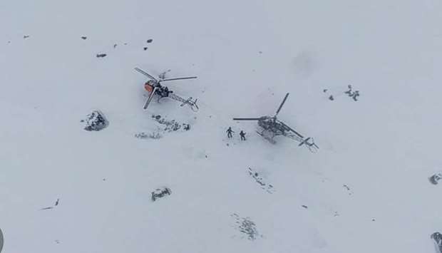 A handout photograph taken on May 8, and released by the Indian Army yesterday shows military helicopters landing to evacuate stranded IAF and Air Dispatch personnel from a high-altitude emergency landing site in Sikkim.