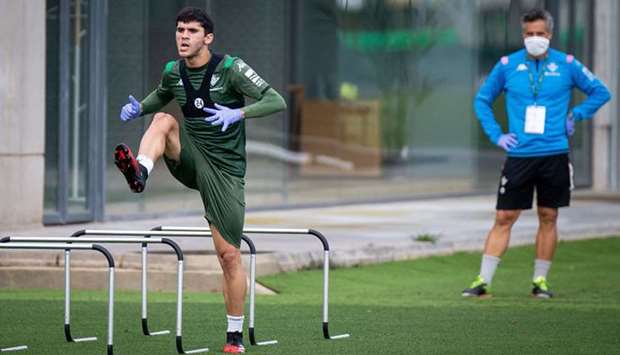 A handout picture released by the Real Betis football club shows Real Betisu2019 Spanish midfielder Carles Alena taking part in a training session at the Luis del Sol training ground in Sevilla yesterday.