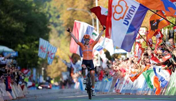 Anna van der Breggen of the Netherlands celebrates as she wins the Womenu2019s Elite Road Race at the UCI Road Cycling World Championships in Innsbruck on September 29, 2018. (Reuters)
