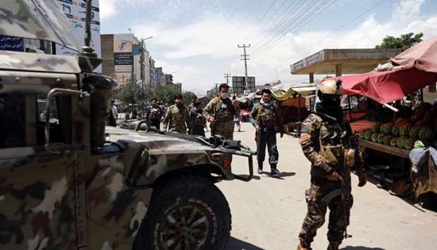 Afghan security forces arrive at the site of an attack in Kabul, Afghanistan