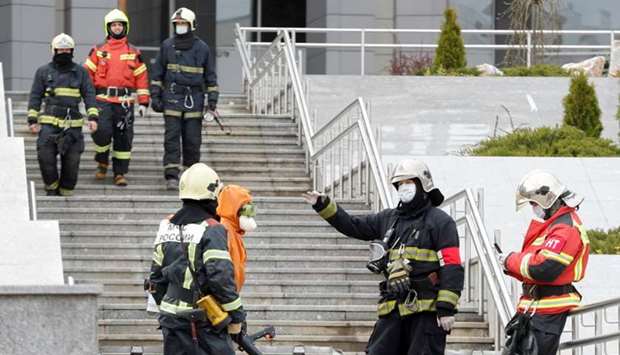 Emergency specialists work on a site of fire, that killed five novel coronavirus patients in an intensive care unit, at a hospital in Saint Petersburg, Russia