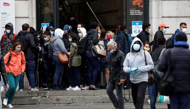 Commuters leave Parisu2019s crowded Saint-Lazare train station yesterday.
