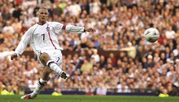 In this October 6, 2001 file photo, Englandu2019s David Beckham scores from a free kick to equalise against Greece in their World Cup qualifier in Manchester. The final score was 2-2 and England qualified for the 2002 World Cup in South Korea and Japan. (Reuters)