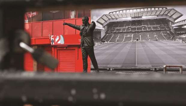 A statue of Liverpoolu2019s late legendary manager Bill Shankly is seen at clubu2019s stadium Anfield in Liverpool, northwest England. Liverpool were on the brink of their first league title for 30 years with a 25-point lead at the top of the table before the season was suspended on March 13. (AFP)