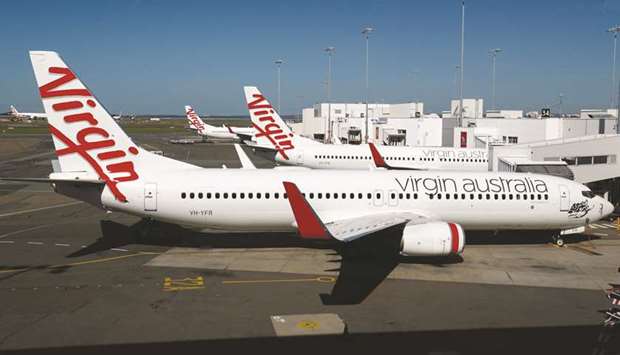 Grounded aircraft operated by Virgin Australia stand on the tarmac at Sydney Airport. The airline became Asiau2019s first carrier to fall to the coronavirus after the outbreak deprived the debt-burdened company of almost all income.