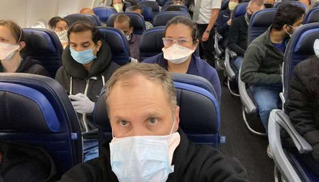 A United Airlines flight from Newark to San Francisco is crowded with passengers in this picture obtained from social media May 9,