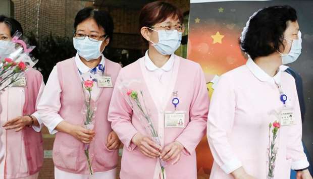 Nurses receive flowers to celebrate the International Nurse day in Taipei, Taiwan
