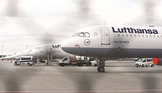 Grounded Airbus A320 passenger aircraft, operated by Deutsche Lufthansa, sit on the tarmac at Munich Airport.