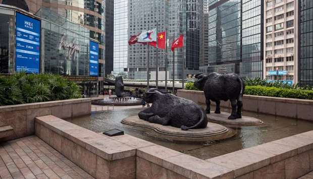 Sculptures of water buffaloes stand outside the Exchange Square complex, which houses the Hong Kong Stock Exchange. The Hang Seng index was down 1.5% to 23,829.74 points yesterday.