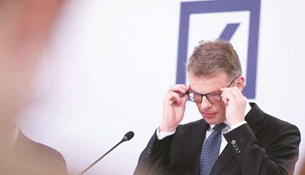 Deutsche Bank CEO Christian Sewing adjusts his spectacles during a news conference in Frankfurt. u201cWe decided to further accelerate our cost reduction programme. Itu2019s precisely because the transformation is essential for the future of our bank and we bear responsibility for a sustainable business model that we will, unfortunately, have to resume these personal discussions,u201d Sewing said yesterday.