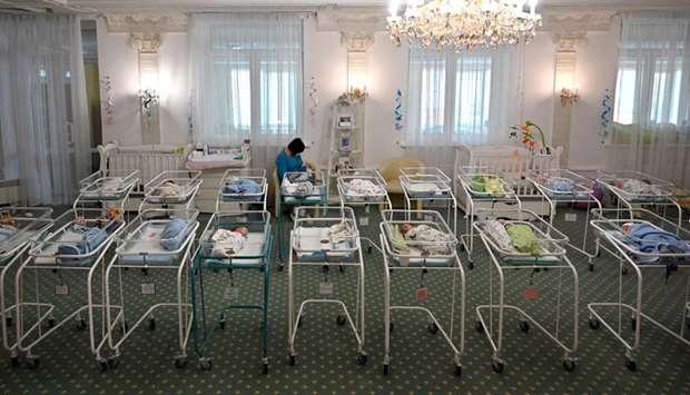 A nurse cares for newborn babies at Kyivu2019s Hotel Venice.