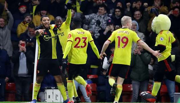 In this February 29, 2020, picture, Watfordu2019s Troy Deeney (left) celebrates scoring a goal with teammates during the Premier League match against Liverpool in Watford, United Kingdom. Deeney has been one of the loudest voices against returning to the pitch so soon. (Reuters)
