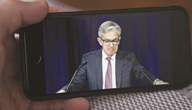 Fed chairman Jerome Powell pauses while speaking during a virtual news conference seen on a smartphone in Arlington, Virginia. Powell is scheduled to appear via video conference along with Treasury Secretary Steven Mnuchin before the Senate Banking Committee tomorrow. Theyu2019re testifying on the $2.2tn virus rescue package passed by the Congress in March.