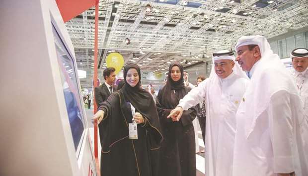 HE the Minister of Transport and Communications Jassim Seif Ahmed al-Sulaiti and HE the Minister of Commerce and Industry Ali bin Ahmed al-Kuwari during a tour of pavilions at Qatar Information Technology Conference & Exhibition, Qitcom 2019. (MoTC file photo)