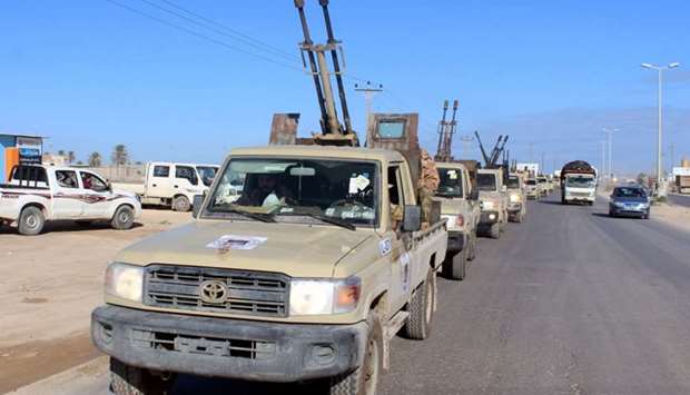 Military vehicles of the Libyan internationally recognised government forces head out to the front line from Misrata, Libya on February 3