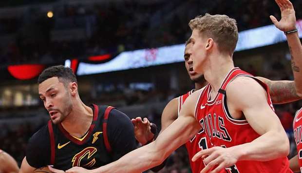 Larry Nance Jr (left) of the Cleveland Cavaliers in action against the Chicago Bulls at the United Center on March 10, 2020. (AFP)