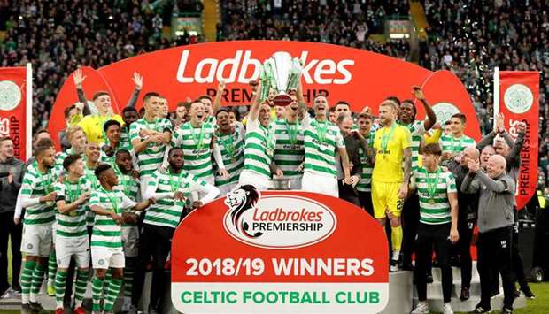 In this May 19, 2019, picture, Celtic players lift the trophy as they celebrate winning the Premiership in Glasgow. (Reuters)
