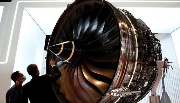 A man looks at Rolls Royce's Trent Engine