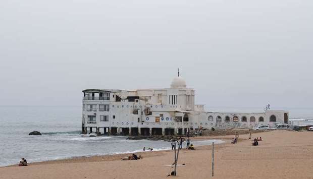 Tunisians spend time at the beach in La Marsa, on the outskirts of the capital Tunis, amid the coronavirus pandemic.