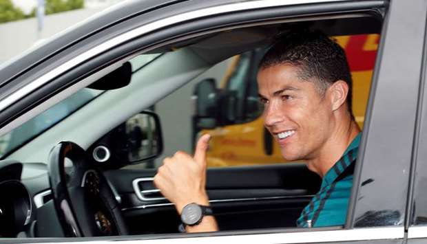 Juventusu2019 Cristiano Ronaldo gestures as he leaves Juventus training centre in Turin, Italy, yesterday. (Reuters)