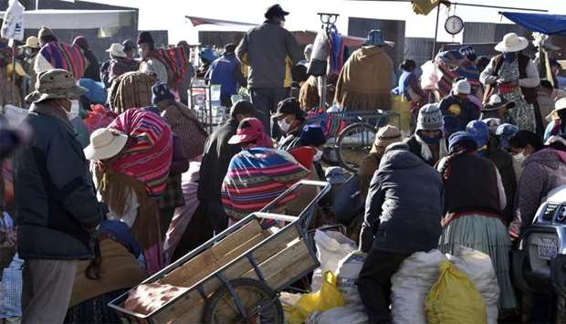 Locals from El Alto, Bolivia, visit a street market despite restrictions banning crowded places regarding the COVID-19 coronavirus pandemic