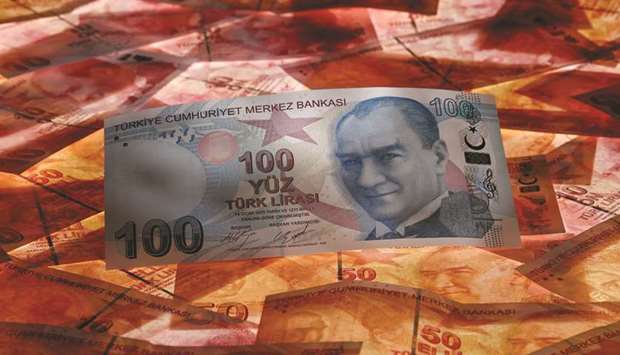 A 100 Turkish lira banknote is seen on top of 50 lira banknotes in this picture illustration in Istanbul (file). The currency is now hovering around its strongest level in over a month.