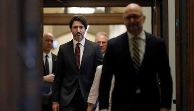 Canada's Prime Minister Justin Trudeau arrives with government ministers