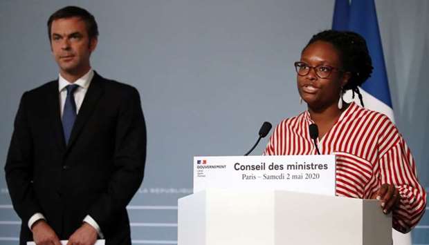 French Health and Solidarity Minister Olivier Veran (L) and French Government's spokesperson Sibeth Ndiaye hold a press conference at the Elysee Palace in Paris on May 2, 2020, following a cabinet meeting on the extension of the state of emergency amid the Covid-19 outbreak caused by the novel coronavirus.