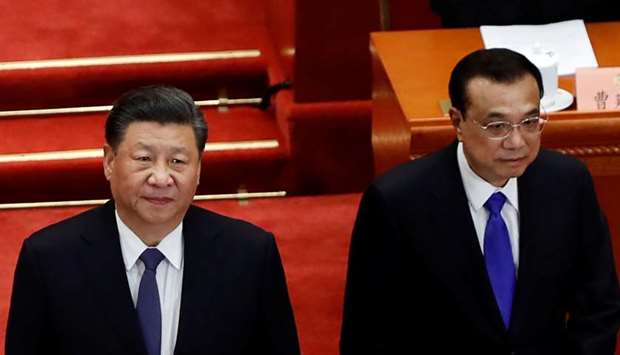 Chinese President Xi Jinping and Premier Li Keqiang arrive for the opening session of the Chinese Peopleu2019s Political Consultative Conference (CPPCC) at the Great Hall of the People in Beijing.