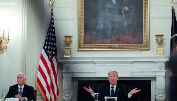 US President Donald Trump talks about taking daily doses of hydroxychloroquine as he addresses a coronavirus disease pandemic meeting with restaurant executives and industry leaders beneath a portrait of President Abraham Lincoln in the State Dining Room at the White House in Washington on May 18