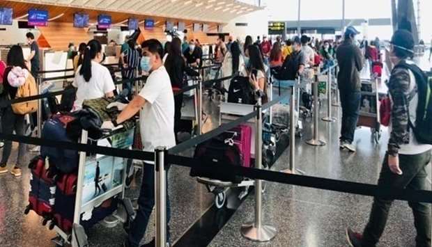 Filipino repatriates patiently queue up at the check-in counters of Hamad International Airport before boarding the plane to Manila. (Picture: Doha PE)