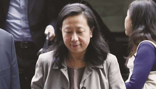 Maggie Wu, chief financial officer of Alibaba Group Holding, arrives for a meeting at the Waldorf Astoria in New York. Wu said the company u201cwill endeavour to comply with any US legislation whose aim is to protect and bring transparency to investors who buy securities on US stock exchanges.u201d