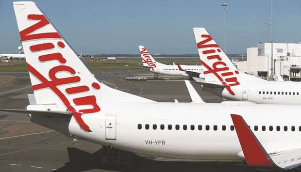 Grounded aircraft operated by Virgin Australia stand on the tarmac at Sydney Airport. Brookfield Asset Management has submitted a proposal before the May 15 deadline for indicative offers for the carrier, but withdrew over concerns about the competitive environment, said sources.