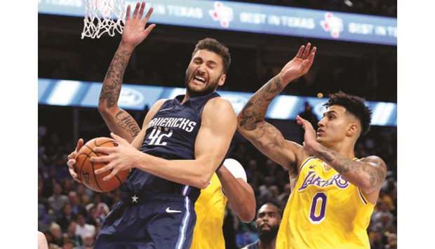 The Dallas Mavericksu2019 Maxi Kleber (left) in action against the Los Angeles Lakers during a regular NBA game at the American Airlines Center in Dallas on November 1, 2019. (TNS)