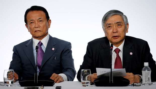 Japanese Finance Minister Taro Aso and Bank of Japan governor Haruhiko Kuroda speak during a news conference at the G7 finance ministers and central bank governors meeting in Chantilly, near Paris. u201cJapanu2019s economy is in an extremely severe state and we need to pull out of this situation as soon as we can,u201d Aso said yesterday.