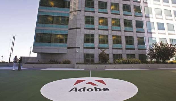 An Adobe logo is displayed on an outdoor basketball court at the companyu2019s headquarters building in San Jose, California. Adobe, Unilever and more than 150 other companies have signed a statement asking officials to ensure their response to the pandemic is u201cgrounded in bold climate actionu201d and to prioritise moving to u201ca green economy by aligning policies and recovery plans with the latest climate science.u201d