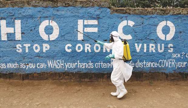 A health worker sprays disinfectants in an effort to stop the spread of the coronavirus disease (Covid-19) in the Kibera slums of Nairobi, Kenya on Friday.