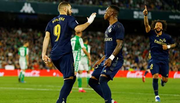 In this March 8, 2020, picture, Real Madridu2019s Karim Benzema celebrates scoring their first goal during the La Liga match against Real Betis at Estadio Benito Villamarin in Seville, Spain. (Reuters)