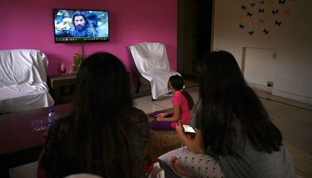 In this picture taken on May 9, members of a family sit together to watch Dirilis: Ertugrul.