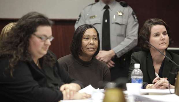 SO NEAR....YET SO FAR: Faye Brown, centre, listens as special deputy Attorney General Tiare Smiley questions North Carolina Correctional Institution for Women superintendent, Kenneth Royster during a hearing in a Wake County courtroom on December 11, 2009.