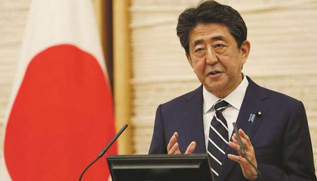 Japanu2019s Prime Minister Shinzo Abe speaks at a news conference in Tokyo. Japan lifted a nationwide state of emergency over the coronavirus yesterday, gradually reopening the worldu2019s third-largest economy as government officials warned caution was still necessary to prevent another wave.